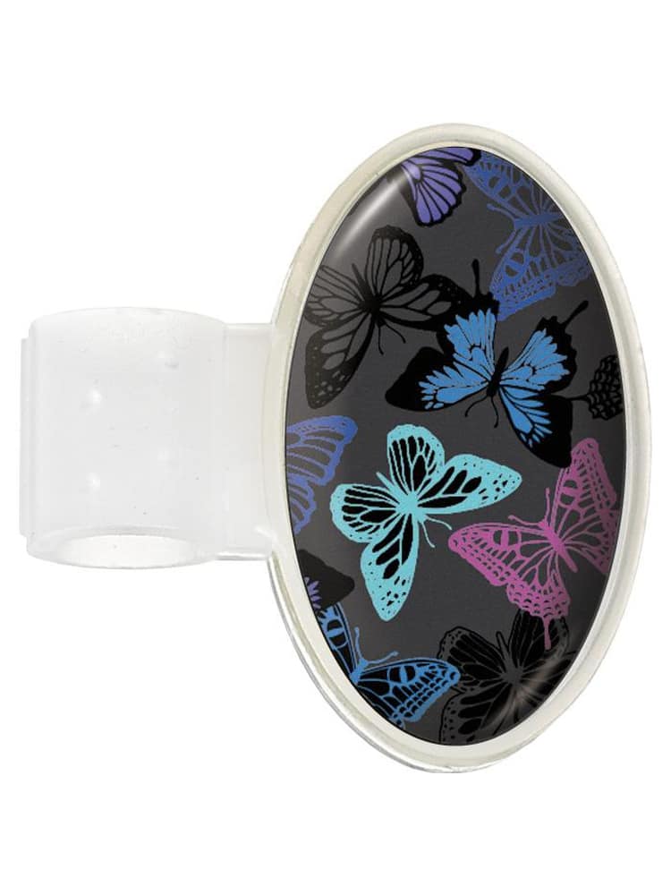 A Prestige Medical Dome ID Tag in "Grey Butterflies" featuring a secure adhesive closure.
