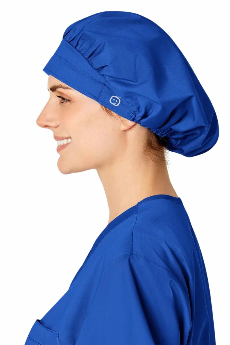 A video of a young female Healthcare Professional displaying the front and back of the WonderWink Women's Bouffant Scrub Cap in Royal Blue.