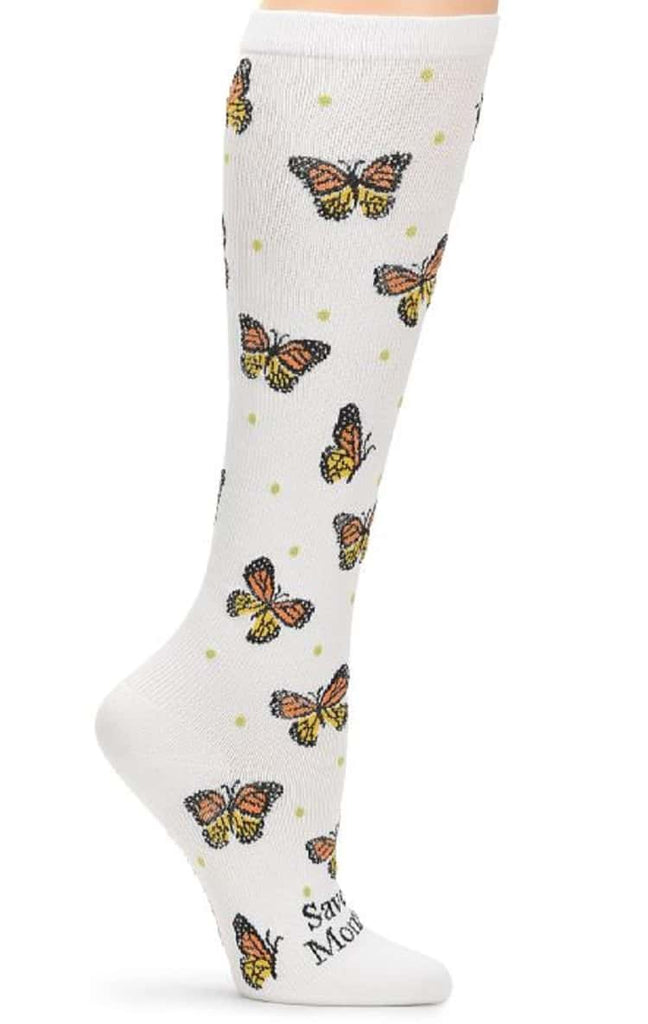 An image of the side of the of Women's Compression Socks from NurseMates in "Save the Monarch" featuring 12-14 mmHg Graduated Compression to help improve circulation and relieve leg fatigue.