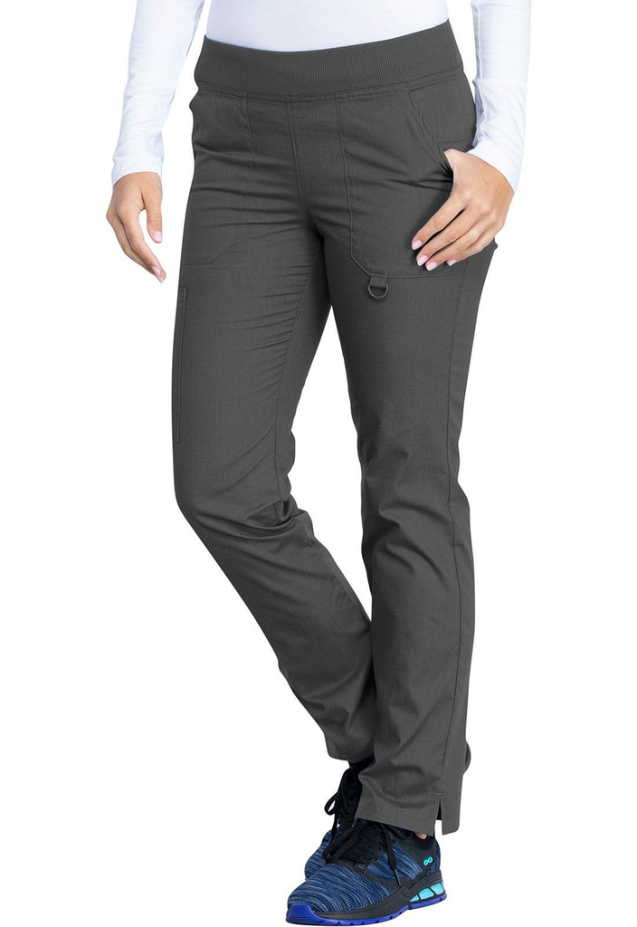 A young female Nurse wearing a Dickies EDS Signature Women's Mid Rise Tapered Leg Pull-on Pant in Pewter size Small Petite featuring an adjustable interior drawstring. 