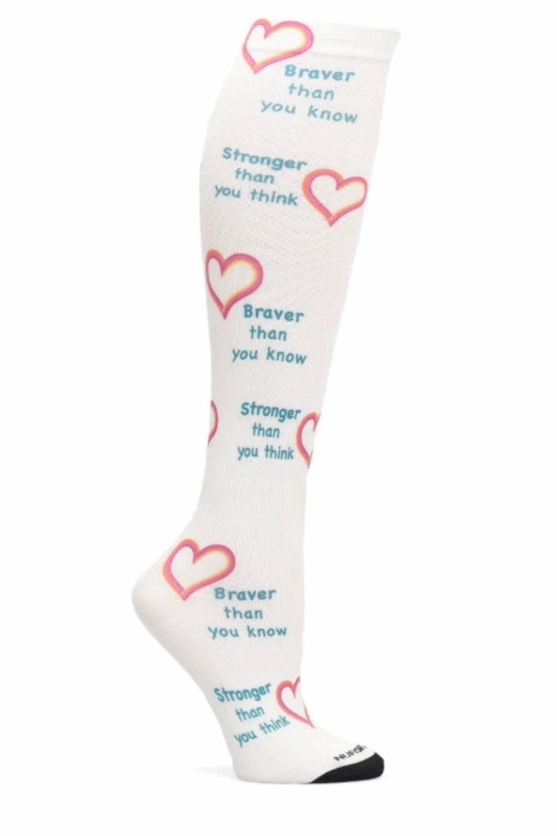 A look at the NurseMates Women's 360° Compression Sock in Stronger/Braver featuring multi-colored hearts on white background with sayings like "braver than you know" and "stronger than you think" scattered throughout.