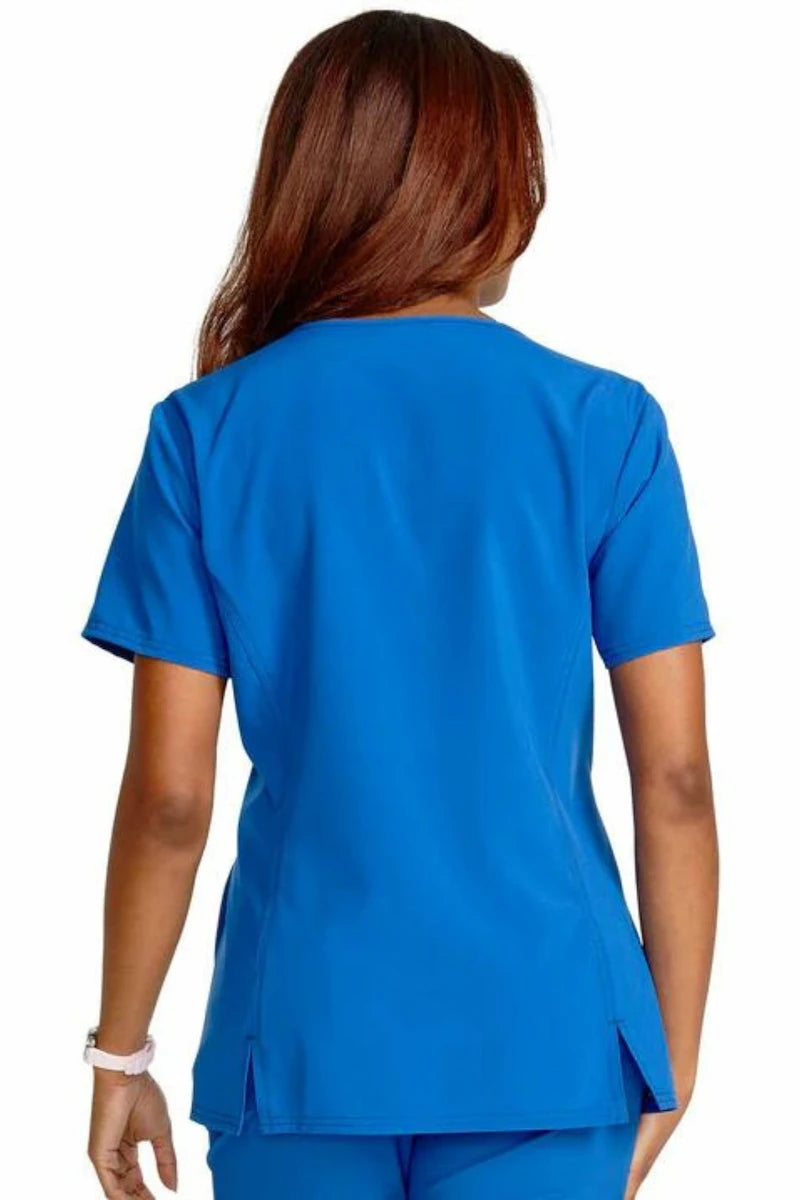 A look at the back of the Tooniforms Women's V-Neck Print Scrub Top in Abominable Snowman in size medium featuring a center back length of 25.5".