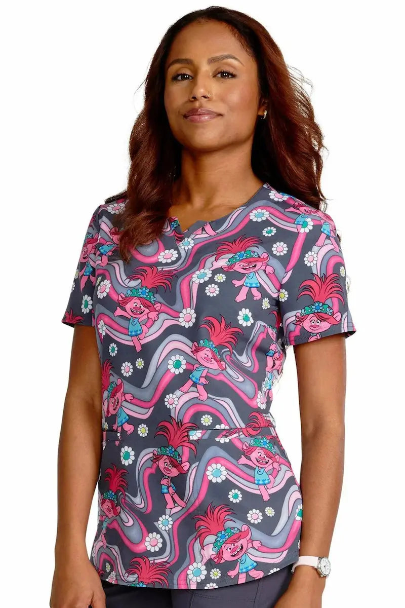 A young woman displaying the front of the Tooniforms Women's V-Neck Print Top in Trollstopia size Small on a white background.