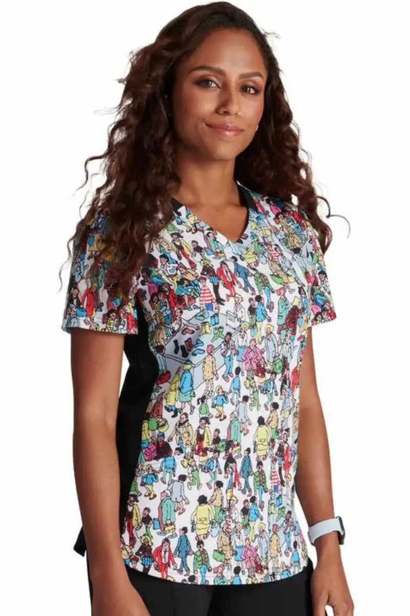 A look at the right side of the "Where's Waldo" Tooniforms Women's V-Neck Print Scrub Top featuring a fun interactive print and contrast side panels.