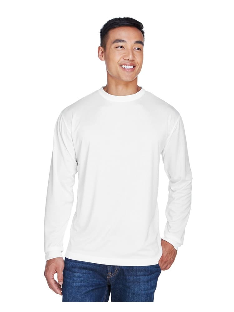 A young male Physical Therapist wearing an UltraClub Men's Cool & Dry Long Sleeve T-Shirt in White size XL featuring an athletic design with a moisture wicking fabric to keep you cool & comfortable all day.
