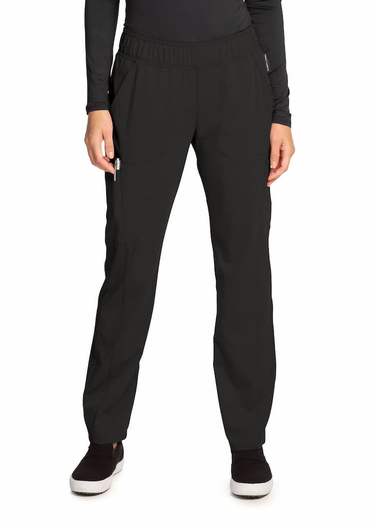 An image of the Vince Camuto Women's Mid Rise Pull-On Scrub Pant in Black size Medium featuring a total of 6 pockets for all of your on the job storage needs.