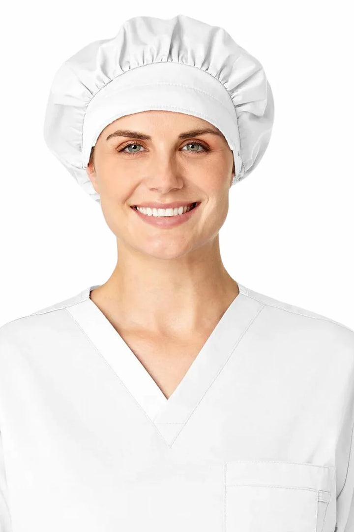 A nurse displaying the WonderWink Women's Bouffant Scrub Cap in White featuring an adjustable stopper at the back for a secure fit.