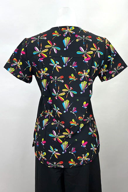An image of the back of the Revel Women's Mock Wrap Print Scrub Top in "Jeweled Dragonflies" featuring a unique 4-way stretch fabric designed to move with your body all day long.