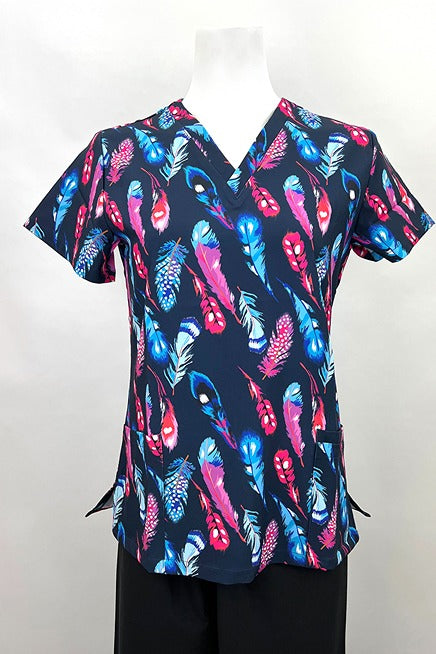 A frontward facing image of the Revel Women's V-Neck Print Scrub Top in "Fancy Feathers" size Medium featuring a total of 3 pockets & a contemporary fit.