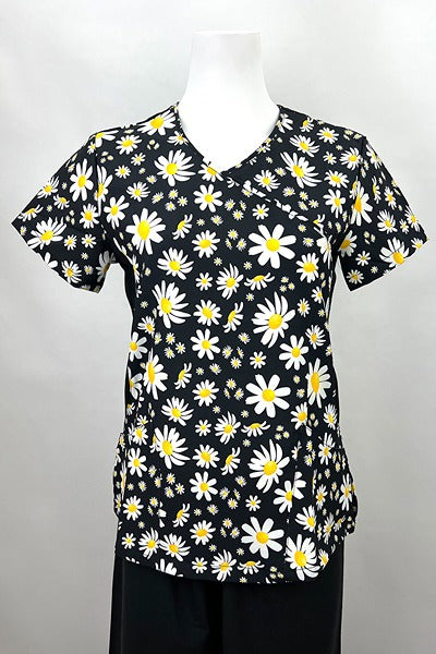 A frontward facing image of the Revel Women's Mock Wrap Print Scrub Top in ''Daisy Power" size XL featuring a 2 front curved patch pockets & a unique 4-way stretch fabric designed to move with your body all day long.