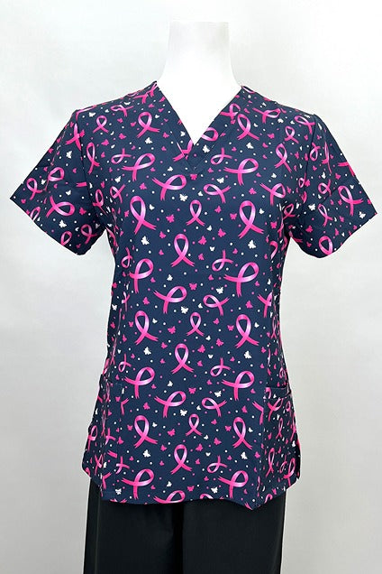 A frontward facing image of the Revel Women's V-neck Print Scrub Top in "Pink Ribbons & Butterflies" size Medium featuring 2 front patch pockets & 1 exterior cellphone pocket.
