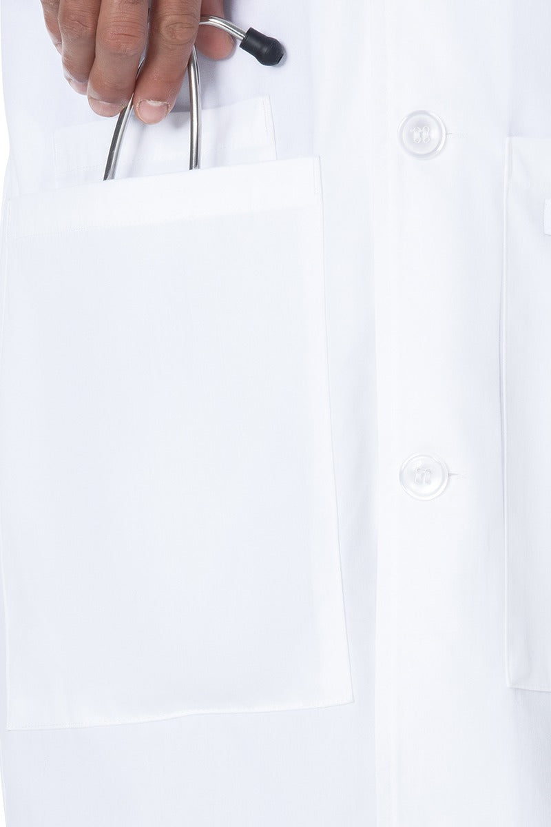A picture of the one of the front patch pocket on the Landau Unisex 4-Pocket Mid-Length Lab Coat in White Sanded size XL showing the hidden inside cell-phone pocket on the wearer's right side.