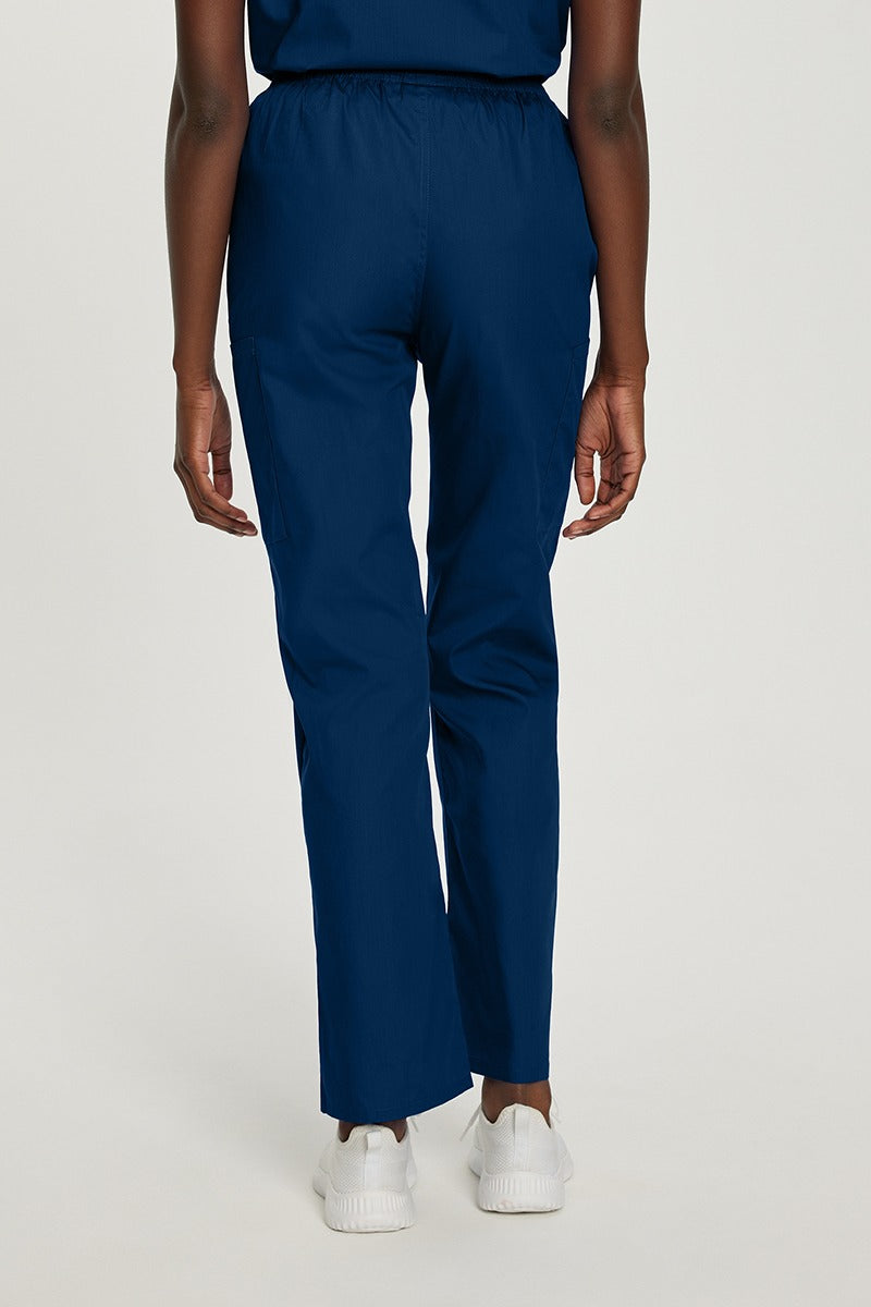 A young female Dental Assistant wearing a Landau Women's Elastic Waist Cargo Scrub Pant in True Navy size Medium featuring a leg opening of 17.625". 