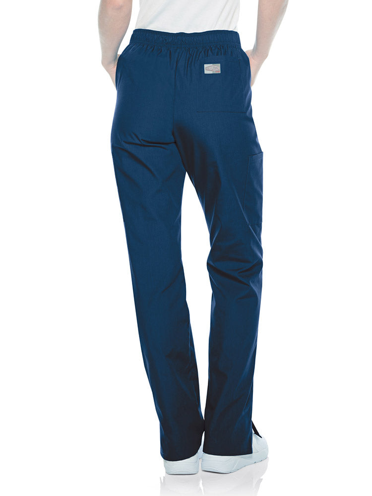 Female nurse wearing a pair of Landau Scrub Zone Women's Straight Leg Cargo Pants in navy featuring a modern tailored fit.