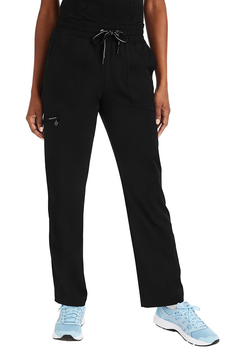 A female Home Health Aide wearing a pair of Purple Label Women's Knit Lined Alaskan Pants in "Black" size XL Petite featuring a luxurious 4-Way stretch fabric.