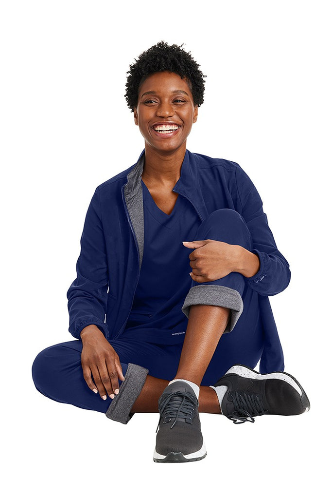 A young female Phlebotomist wearing a Purple Label Women's Knit Lined Alaskan Pant in "Navy" size Medium Petite featuring a soft knit lining throughout.