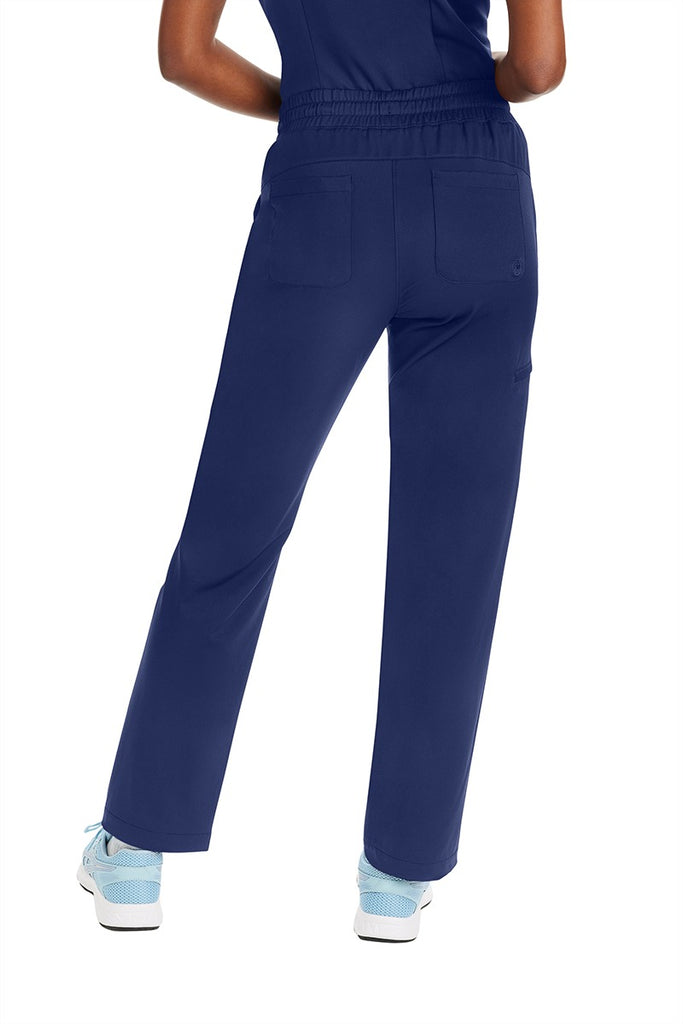 A young lady Physician wearing a Purple Label by Healing Hands Women's Knit Lined Alaskan Pant in "Navy" size XS featuring 2 back patch pockets.
