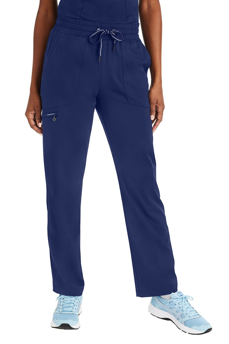A female Home Health Aide wearing a pair of Purple Label Women's Knit Lined Alaskan Pants in "Navy" size Large featuring a luxurious 4-Way stretch fabric.