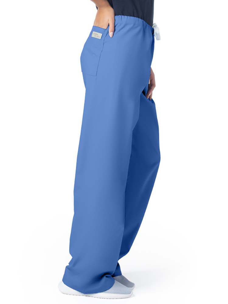 Female healthcare professional wearing a pair of Urbane Essentials Women's Straight-Leg Pants in "Ceil Blue" featuring 1 back patch pocket.