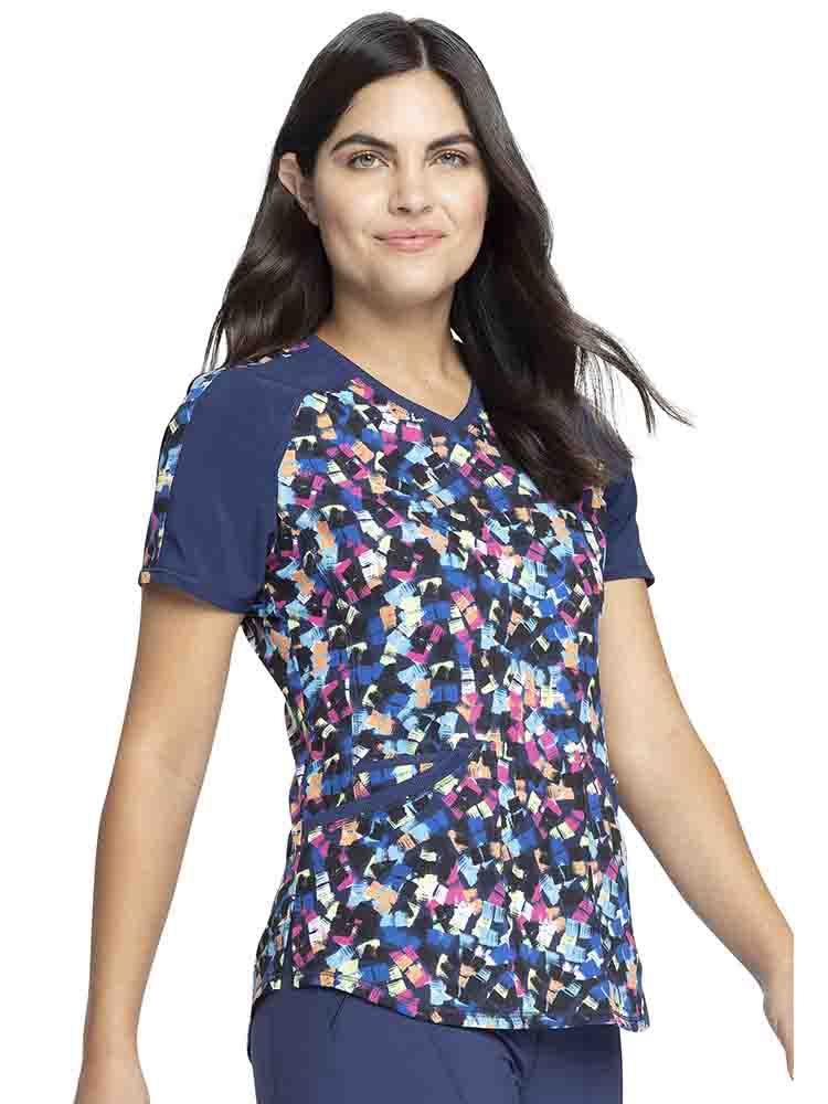 Young lady wearing a Cherokee Infinity Women's V-Neck Print Top in "Loving Lines" featuring 2 set-in pockets.
