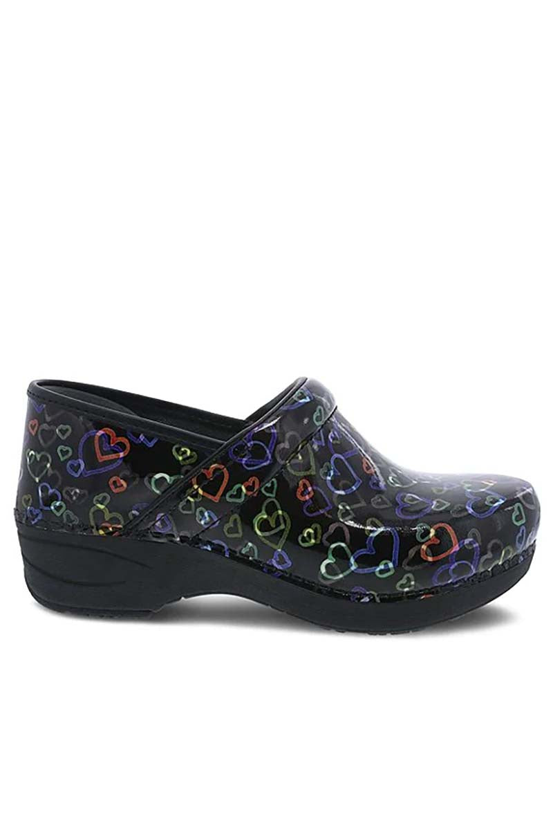 A side view of the Dansko XP 2.0 Nurse Shoe in "Floating Hearts Patent" featuring a patented slip-resistant rubber outsole.
