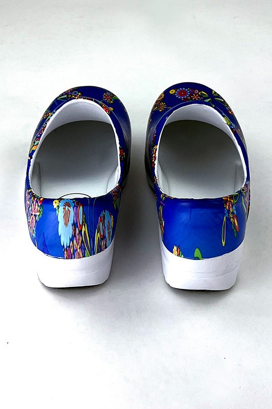 A view of the back of the StepZ Women's Slip Resistant Memory Foam Clog in "Butterfly Bouquet" size 7 featuring a classic slip-on style & a heel height of roughly 1.5".