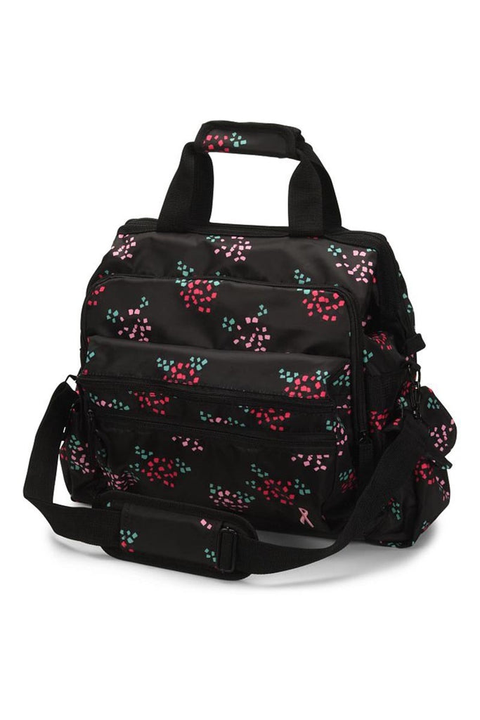 A frontward facing image of the Ultimate Medical Bag from NurseMates in "Confetti Flower with Ribbon" featuring a hardwearing shoulder strap with heavy duty zippers & multiple compartments for maximum storage room.