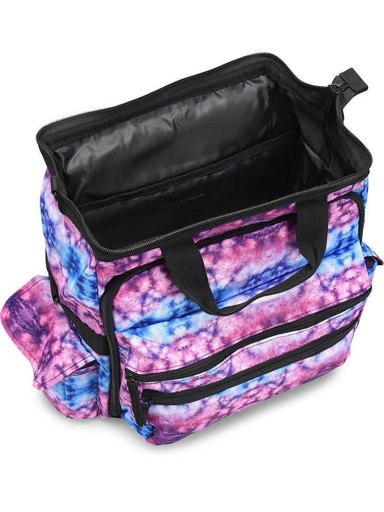 A top down view of the Nurse Mates Ultimate Medical Bag in "Berry Blue Tie Dye" featuring a large hinged mouth for all of your on the go storage needs.