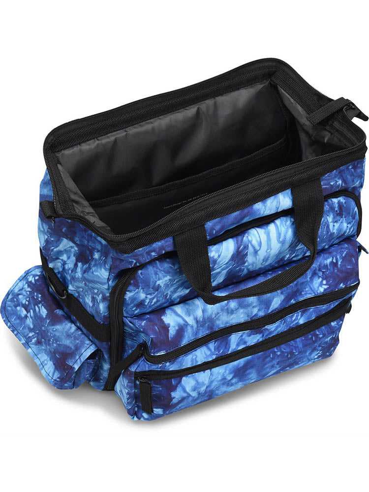 An aerial view of the Nurse Mates Ultimate Medical Bag in "Blue Crystals Tie Dye" featuring a large hinged mouth for all of your on the go storage needs.