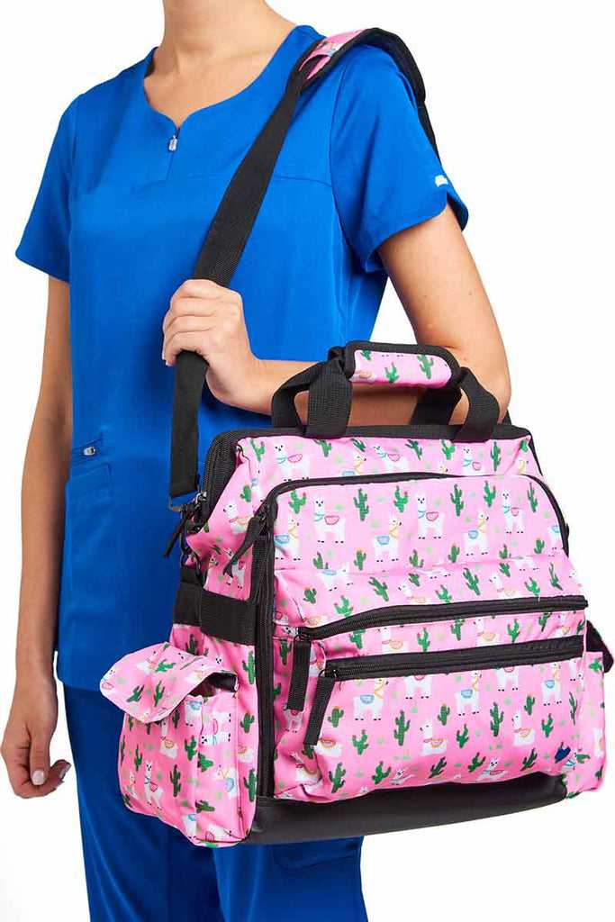 A young female CNA carrying the Nurse Mates Ultimate Medical Bag in "Llama Land" featuring a hardwearing shoulder strap.