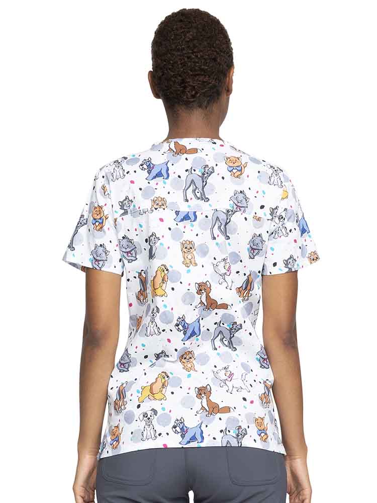 Female nurse wearing a Tooniforms Women's V-Neck Print Scrub Top in Cats & Dogs featuring a center back yoke to ensure a flattering shape.