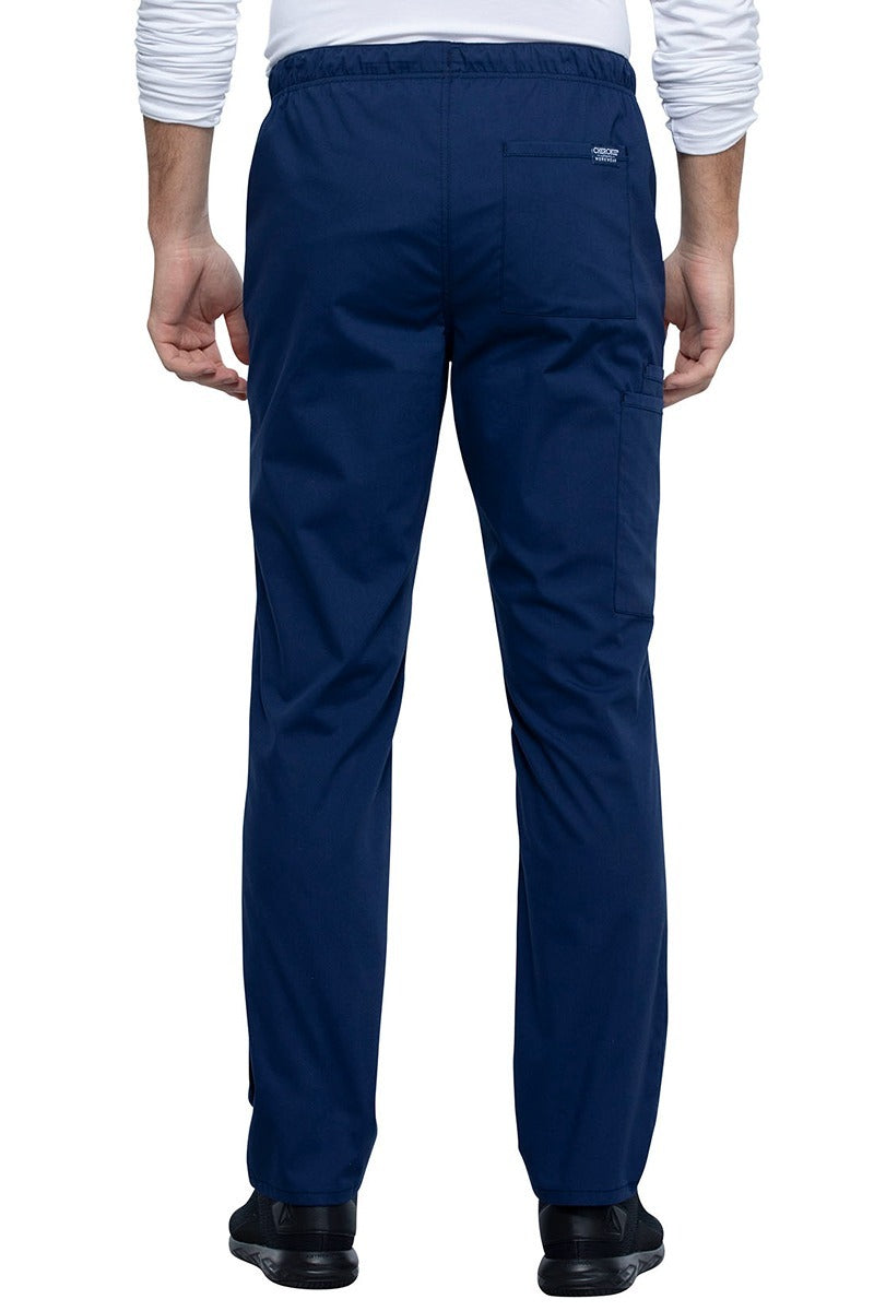 A backward facing image of the Cherokee Unisex Straight Leg Drawstring Scrub Pant in Navy size XL featuring 1 back patch pocket on the wearer's left side.