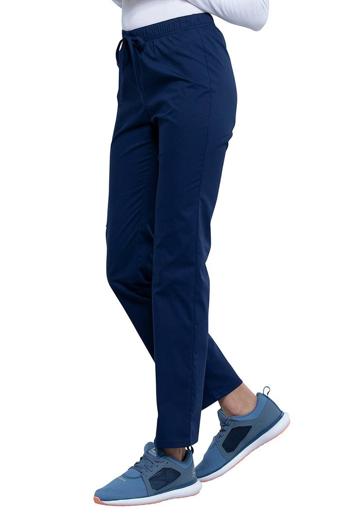 An image of the side of the Cherokee Unisex Straight Leg Scrub Pant in Navy size Large Petite featuring a soft, stretchy Workwear Revolution fabric.