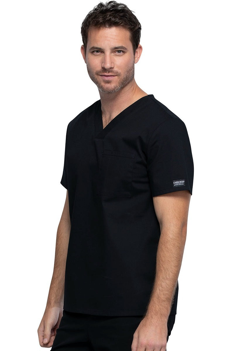 A picture of a young Male Phlebotomist wearing a Cherokee Unisex Tuckable V-neck Scrub Top in Black size Large featuring pull-on closure.