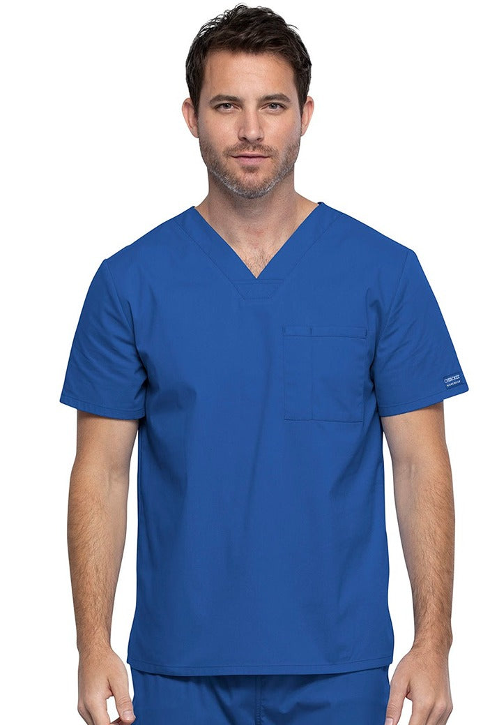 A middle aged Male Physician wearing a Cherokee Unisex Tuck-in V-neck Scrub Top in Royal size XL featuring 1 front chest pocket.