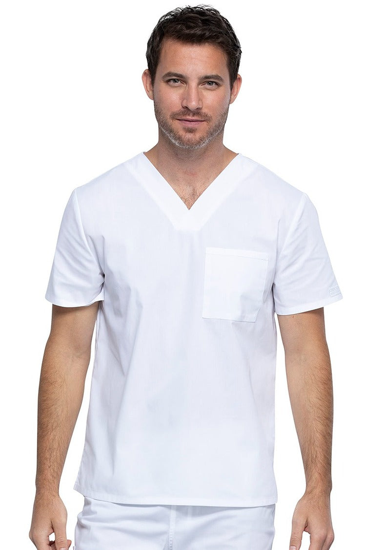 A middle aged Male Physician wearing a Cherokee Unisex Tuck-in V-neck Scrub Top in White size XL featuring 1 front chest pocket.