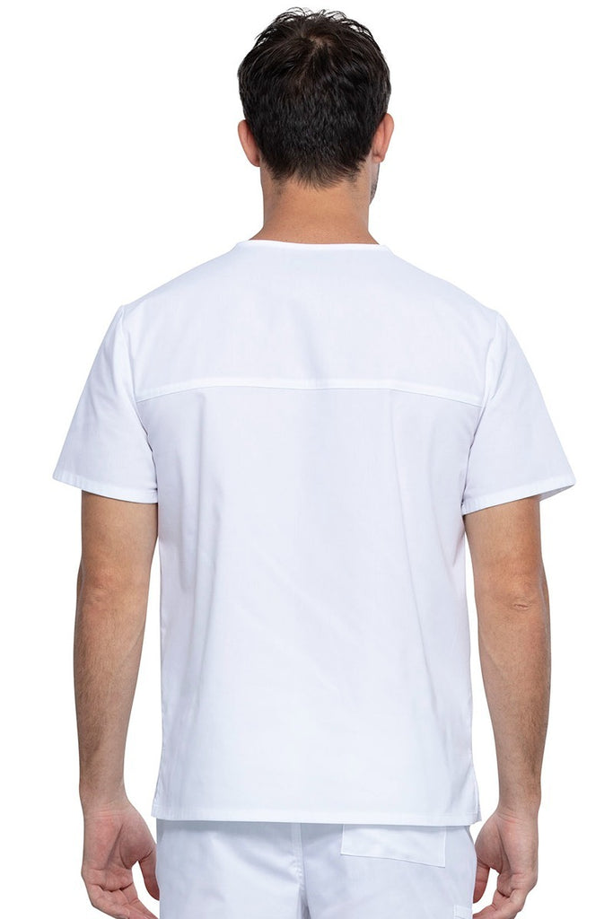 An image of a Male Medical Assistant wearing a Cherokee Unisex Tuckable V-neck Scrub Top in White size 3XL featuring a back yoke & dolman sleeves.