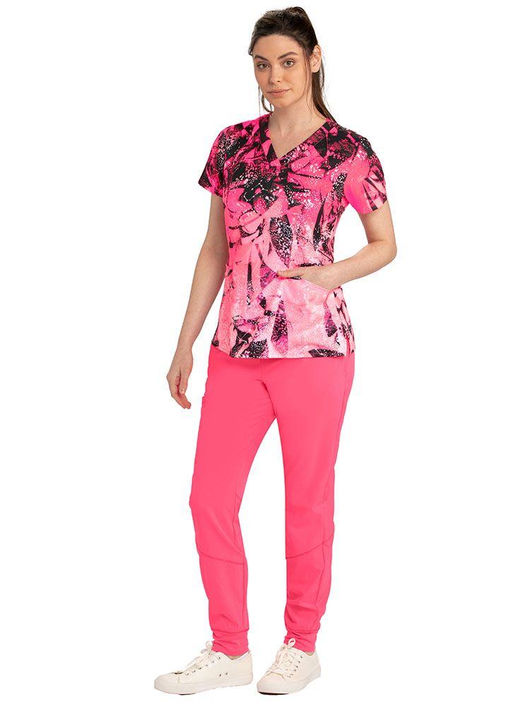 LPN wearing Barco One Women's Print V-Neck Scrub Top in Crystal Shallows print & matching joggers