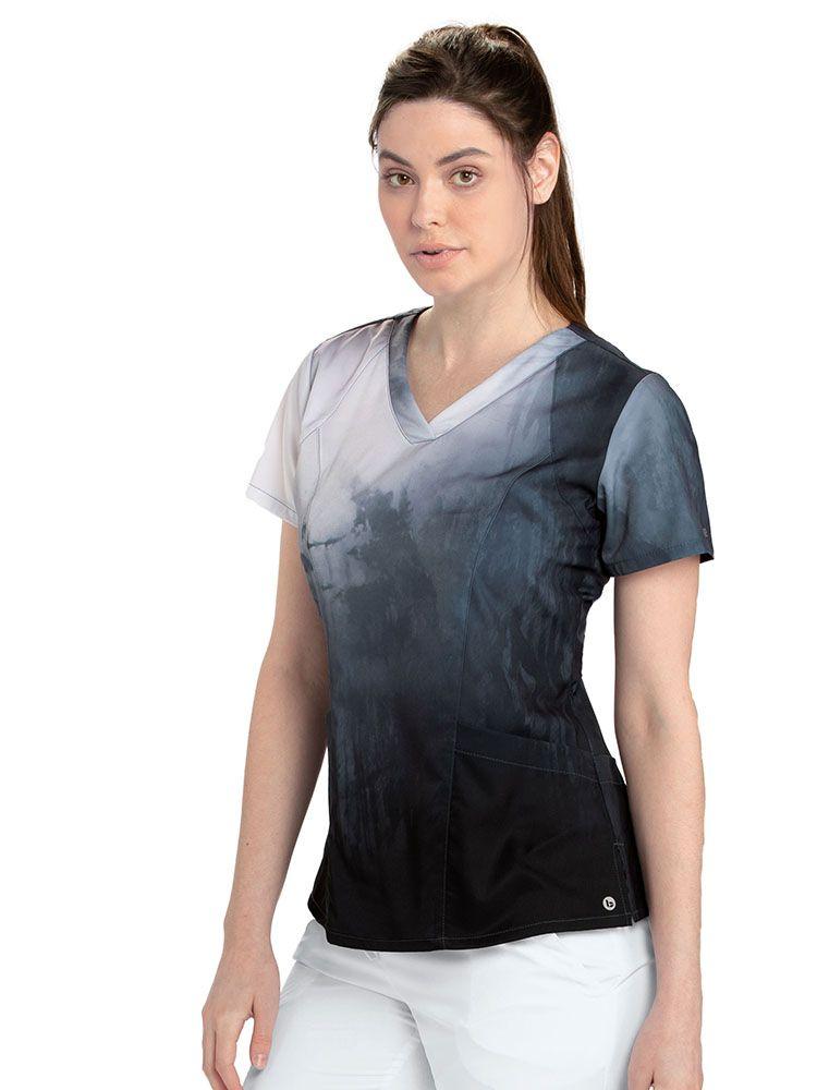 Dentist wearing Barco One Women's Print V-Neck Scrub Top in Thermal Springs print