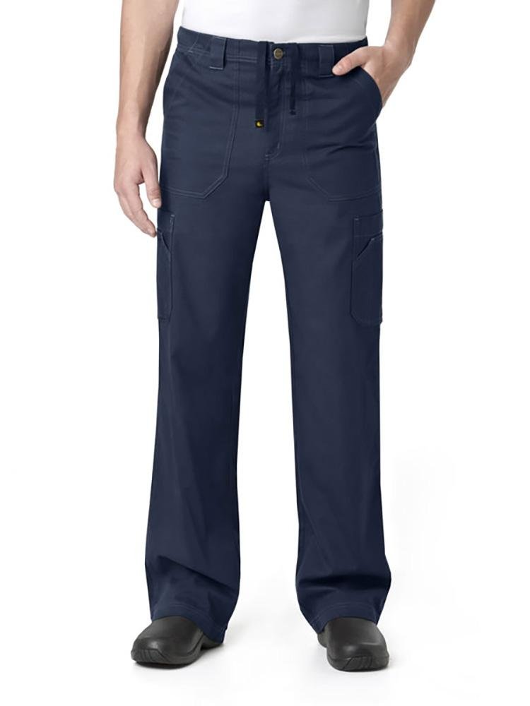 A male Lab Tech wearing a Carhartt men's Multi-Pocket Cargo Scrub Pant in navy size medium featuring a drawstring at the waist.