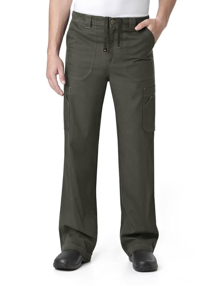 A male Sonographer wearing a Carhartt men's Multi-Pocket Cargo Scrub Pant in olive size large featuring triple-stitched outseams.