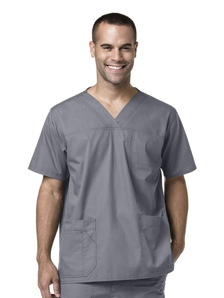 A male Physical Therapy Assistant wearing Carhartt men's Ripstop Multi-Pocket Scrub Top in pewter size large featuring short sleeves.