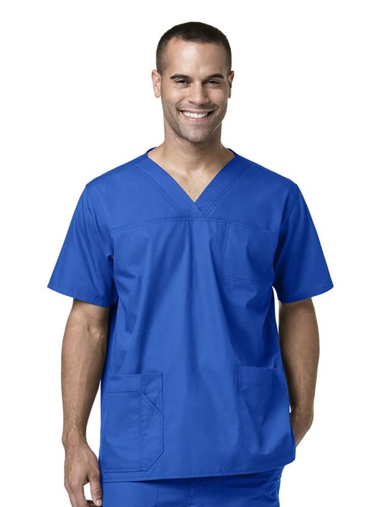 A male Licensed Vocational Nurse wearing Carhartt men's Ripstop Multi-Pocket Scrub Top in royal size extra large featuring a v-neckline.