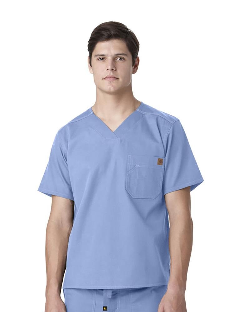 A male Dermatologist wearing a Carhartt men's Ripstop Utility Scrub Top in ceil size small featuring a tag-less neck label for a smooth feel & comfortable fit.