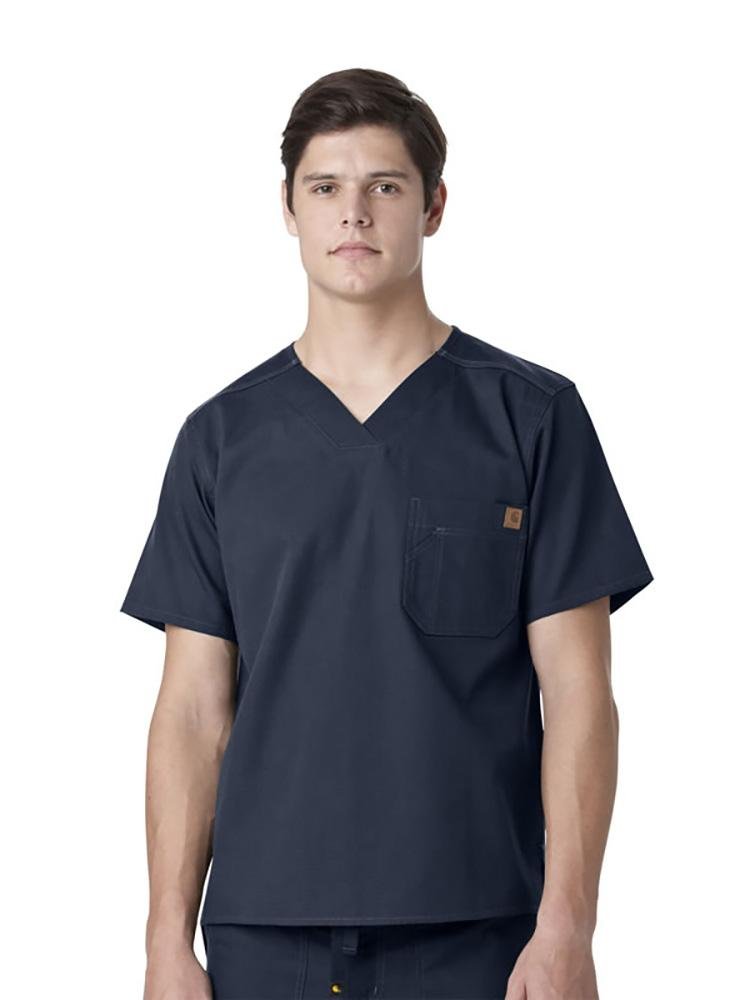 A male Occupational Therapist wearing a Carhartt men's Ripstop Utility Scrub Top in navy size 3X featuring a drop tail hem.