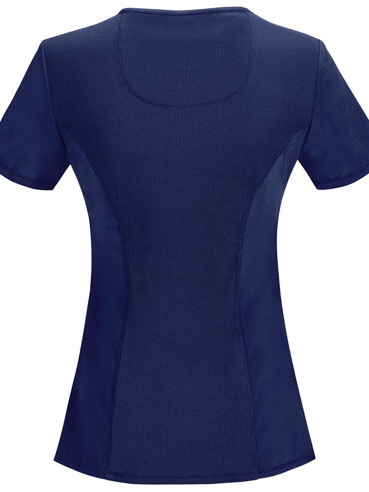 An image of the back of the Cherokee Infinity Women's Antimicrobial Mock Wrap Top in Navy featuring a ribbed knit stretch panel.