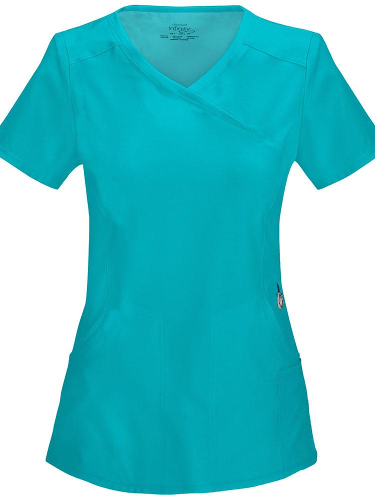 A frontward facing image of the Cherokee Infinity Women's Antimicrobial Mock Wrap Top in teal featuring a Contemporary fit with two set-in front pockets.