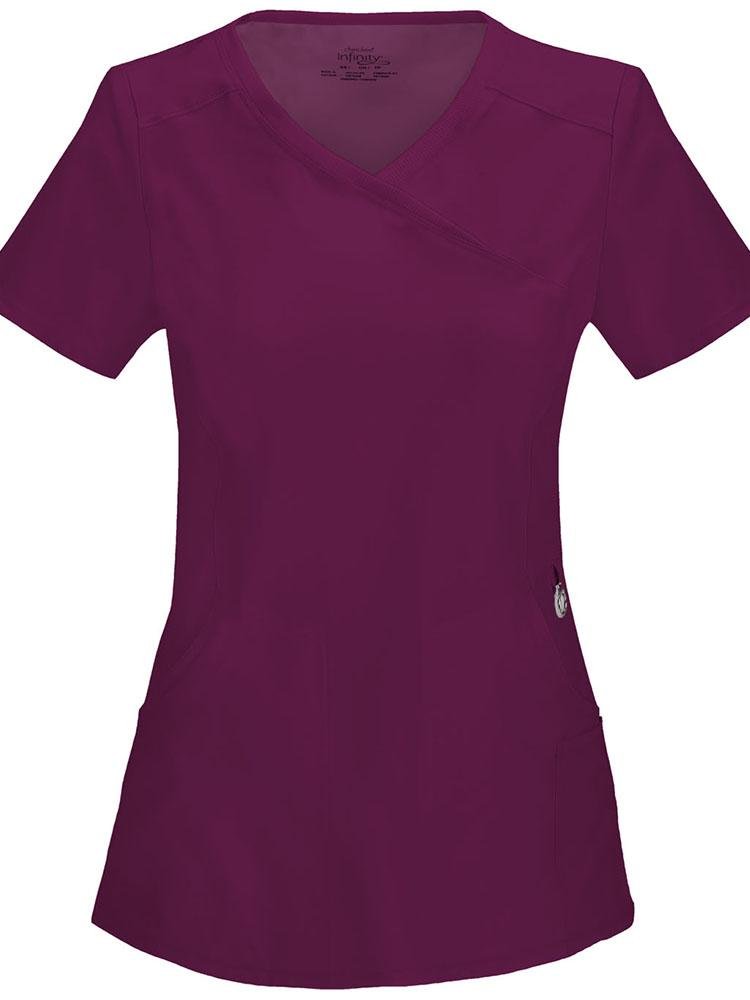 A frontward facing image of the Cherokee Infinity Women's Antimicrobial Mock Wrap Top in wine featuring front and back princess seams for a fitted look.