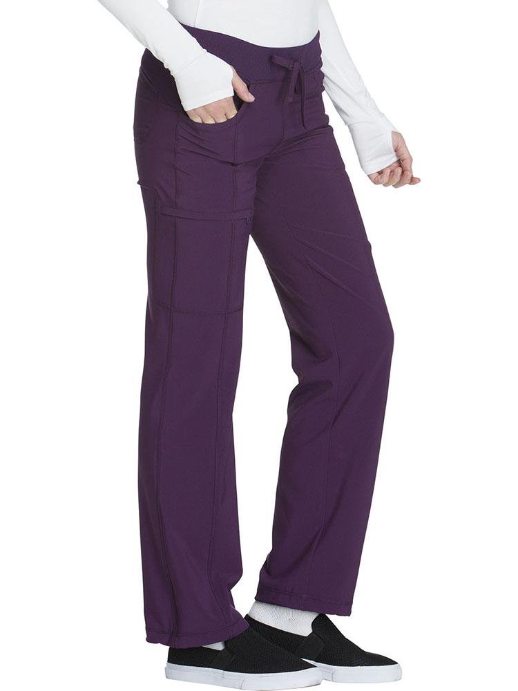 A young female Physical Therapist wearing a Cherokee Infinity Women's Low-Rise Straight Leg Scrub Pant in eggplant featuring a moisture-wicking fabric.