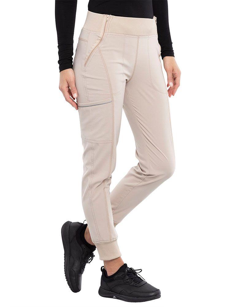 Cherokee Infinity Women's Mid Rise Tapered Jogger in khaki featuring a rib knit elastic waistband